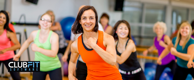 female instructor leading an aerobic class