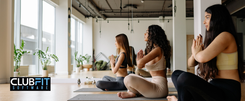 girls doing yoga in a group setting